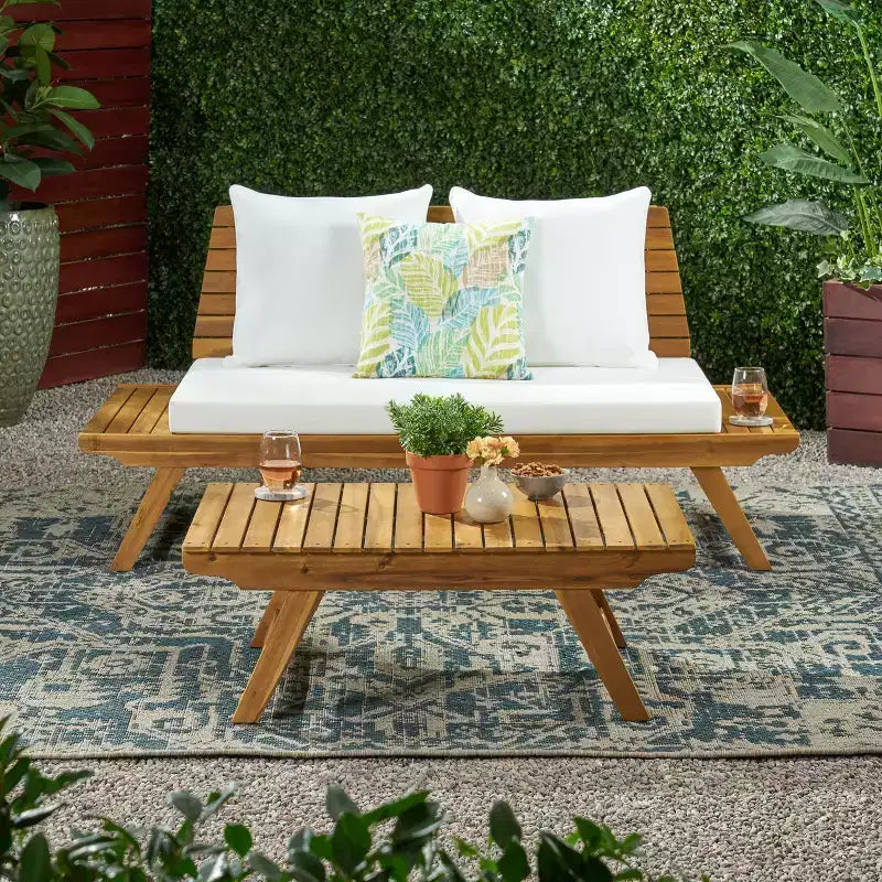 Ensemble causeuse et table basse d'extérieur en bois d'acacia avec coussin