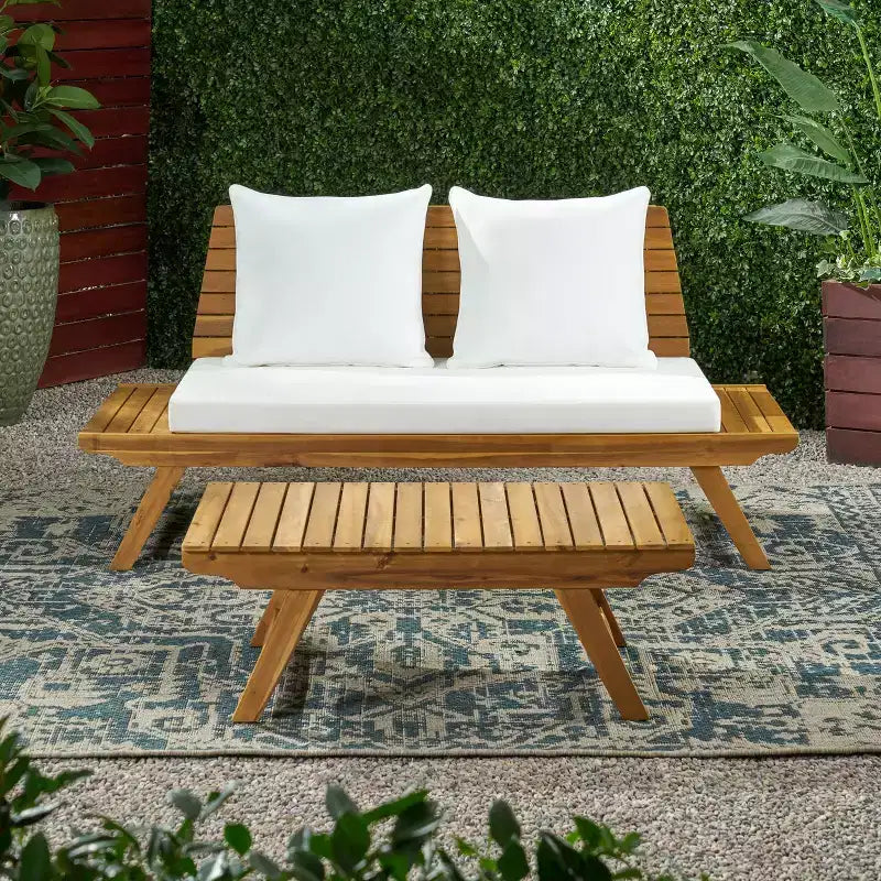 Ensemble causeuse et table basse d'extérieur en bois d'acacia avec coussin