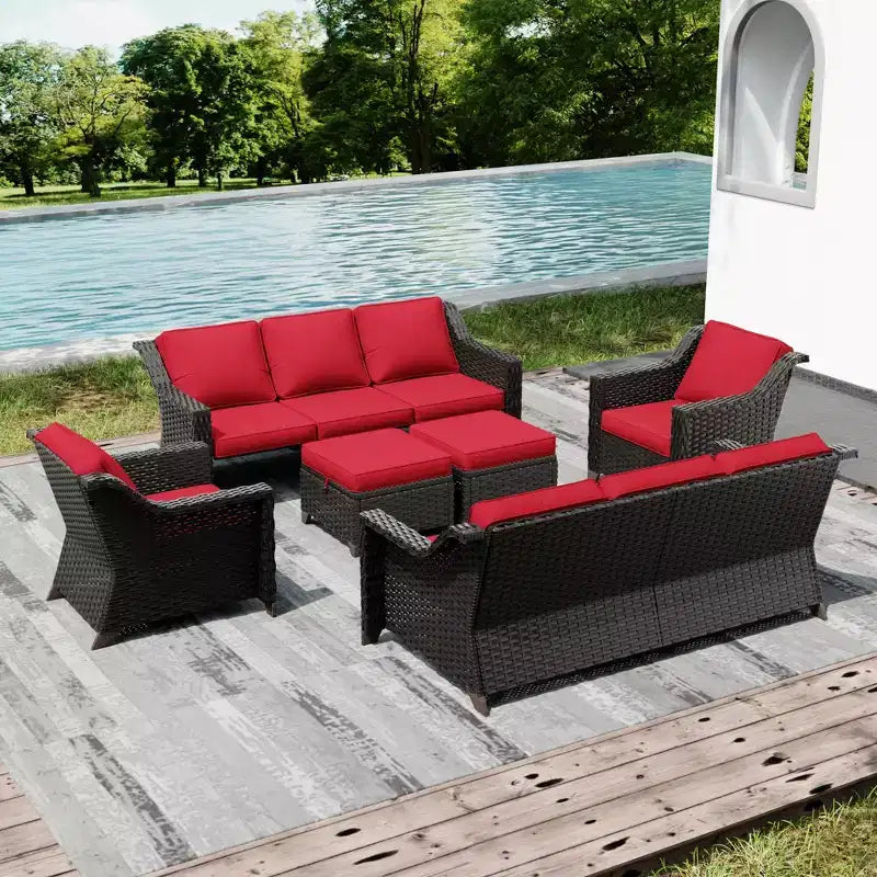 Ensemble de patio extérieur avec deux canapés, des chaises, des poufs et une table brasero pour des réunions spacieuses